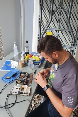 Alain repairing a radio
